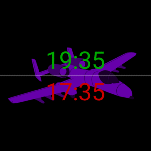Zulu Face con una silueta morada de un A-10 Thunderbolt II detrás de las horas: hora local 19:35 en verde arriba, hora Zulú/UTC 17:35 en rojo abajo, sobre negro.